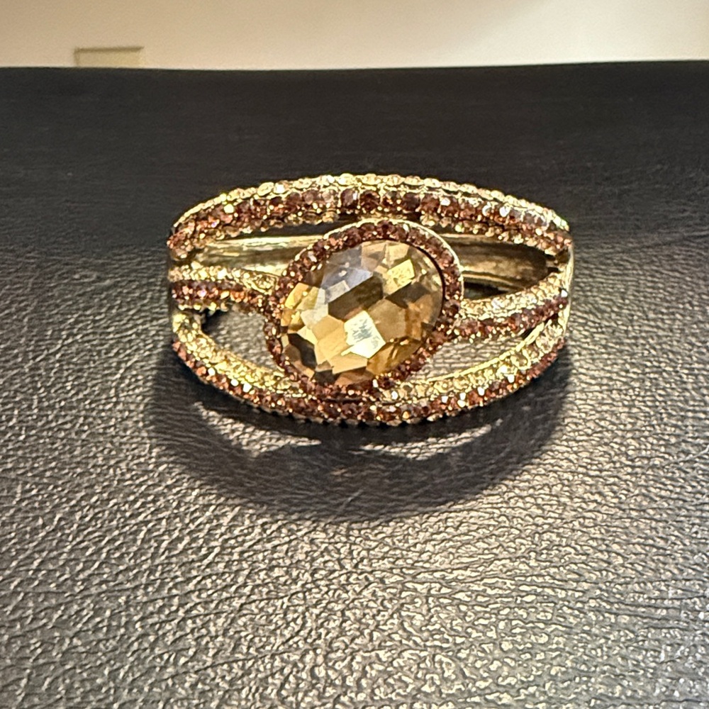 Gold Tone Statement Cuff Bracelet with Brown Crystal Center